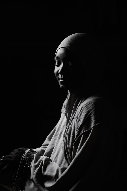 Free Emotive black and white portrait of a woman wearing traditional attire, highlighting subtle emotions. Stock Photo