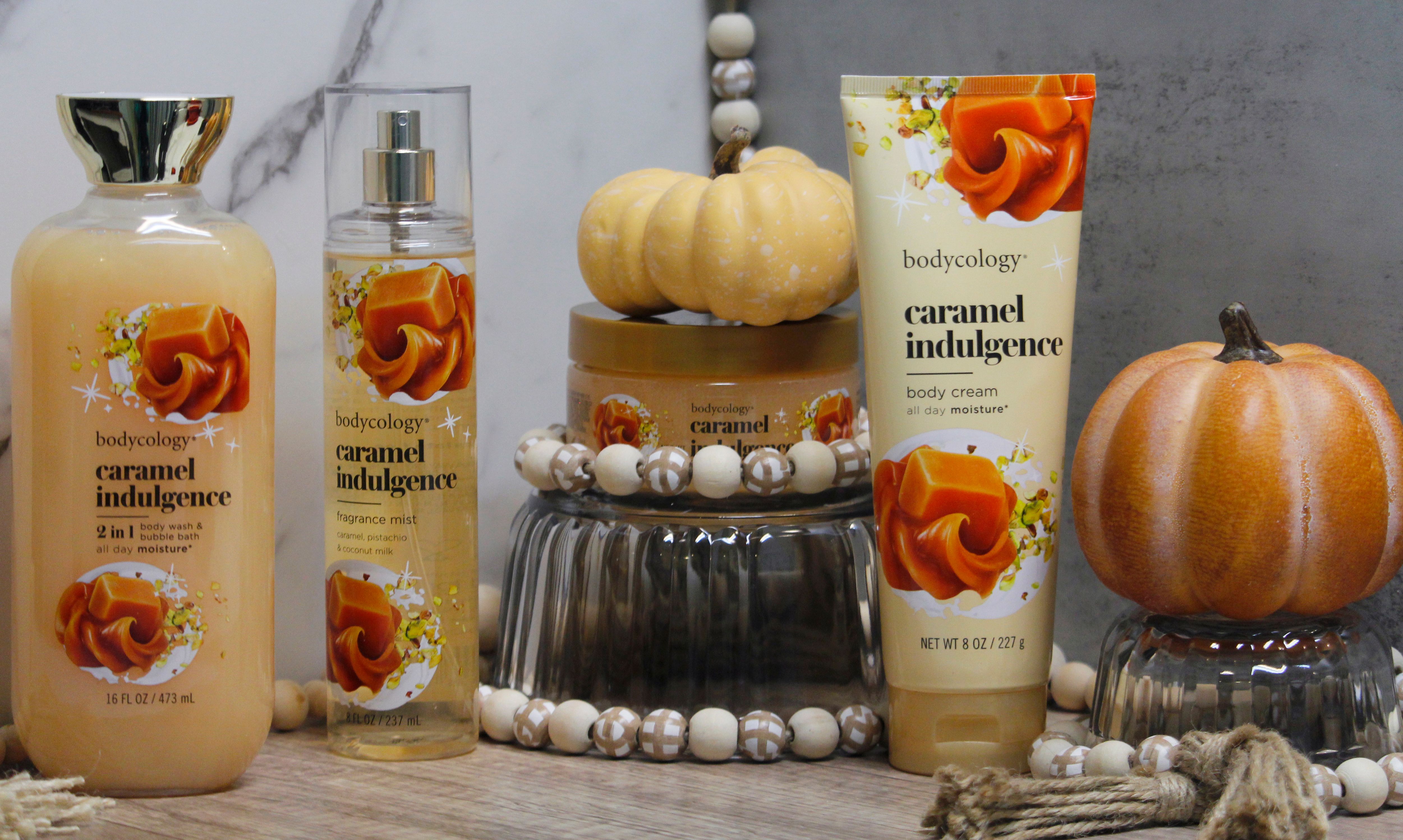 Bodycology caramel indulgence products with autumn decor and pumpkins.