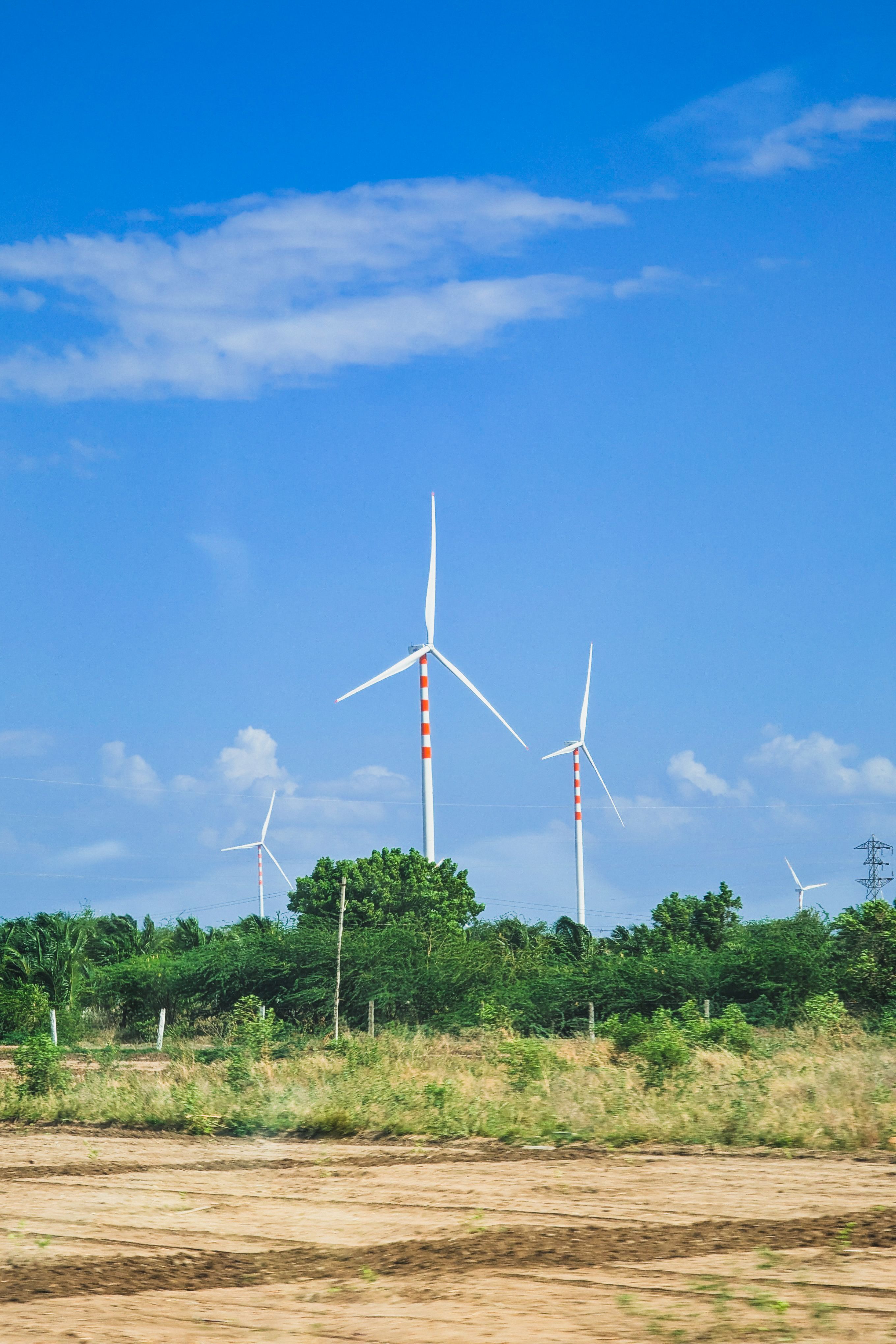 Wind Turbines in Green Landscape under Blue Sky · Free Stock Photo