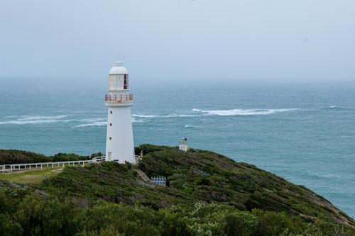 Free Beautiful coastal view of Cape Otway Lighthouse in Victoria, Australia, with lush greenery and ocean backdrop. Stock Photo