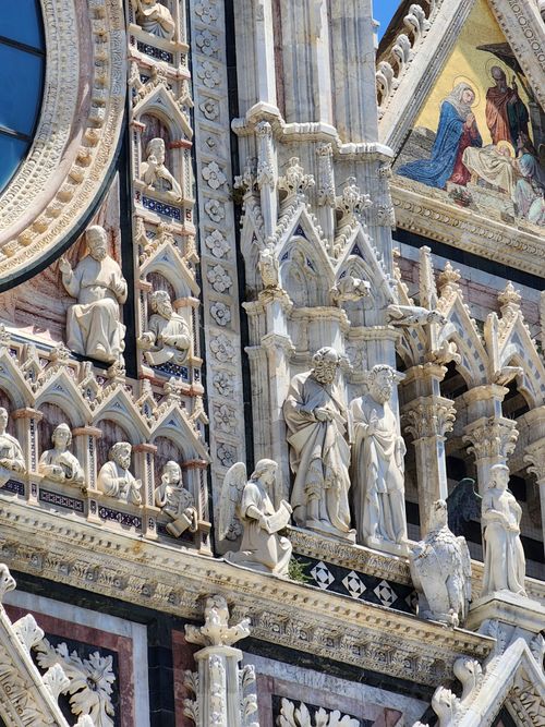 Free Intricate marble sculptures on the facade of Siena Cathedral, Italy. Stock Photo