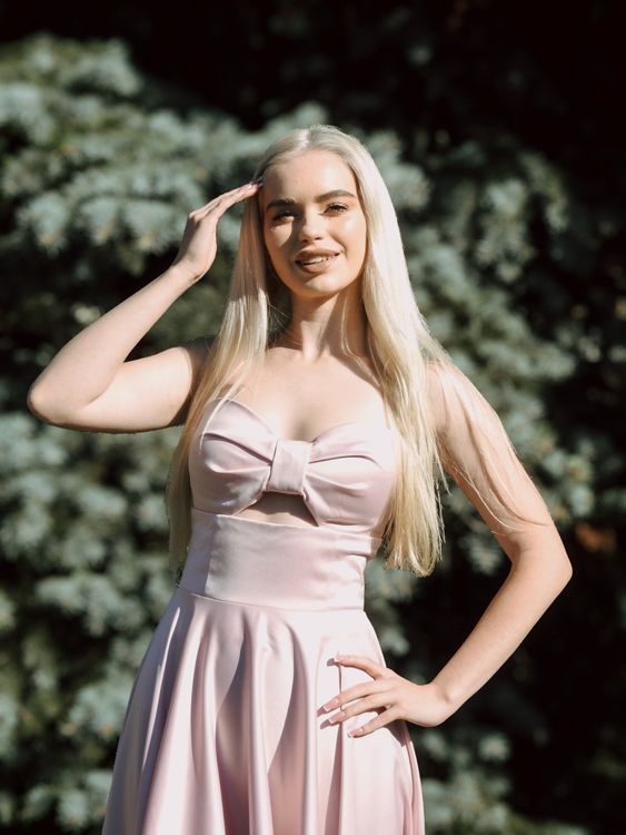 Elegant Woman in Pink Dress Outdoors · Free Stock Photo