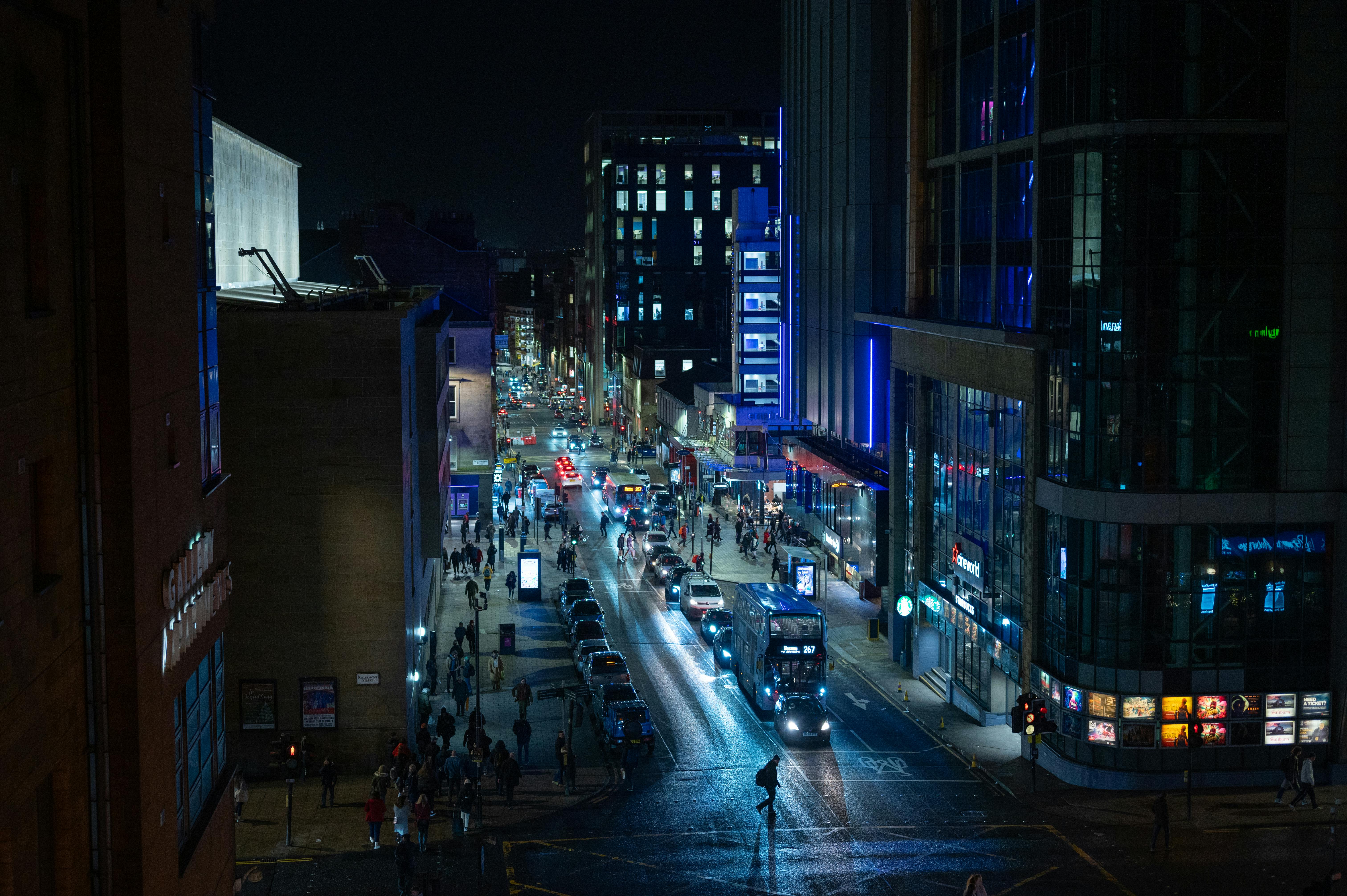 Explore the bustling nightlife and urban streets of Glasgow, Scotland under city lights.