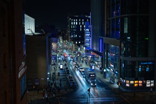 Explore the bustling nightlife and urban streets of Glasgow, Scotland under city lights.