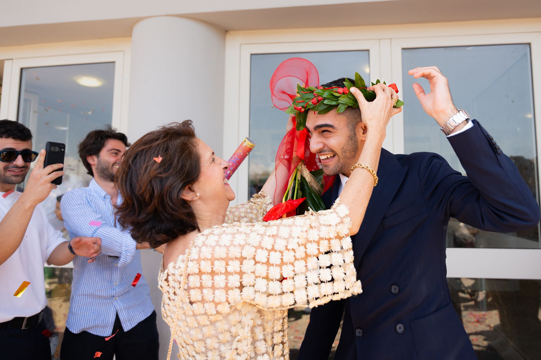 marassi summer event planner — A joyful graduation celebration with family and friends, featuring confetti and a laurel wreat