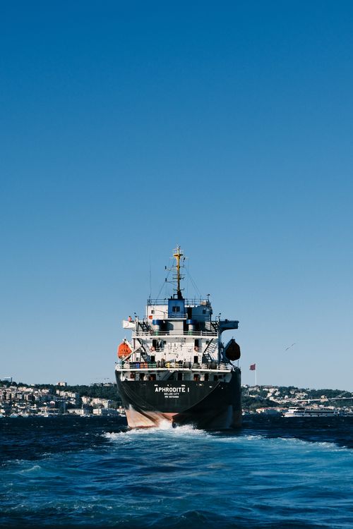 Free A ship sails through Istanbul's Bosphorus under a clear summer sky. Stock Photo