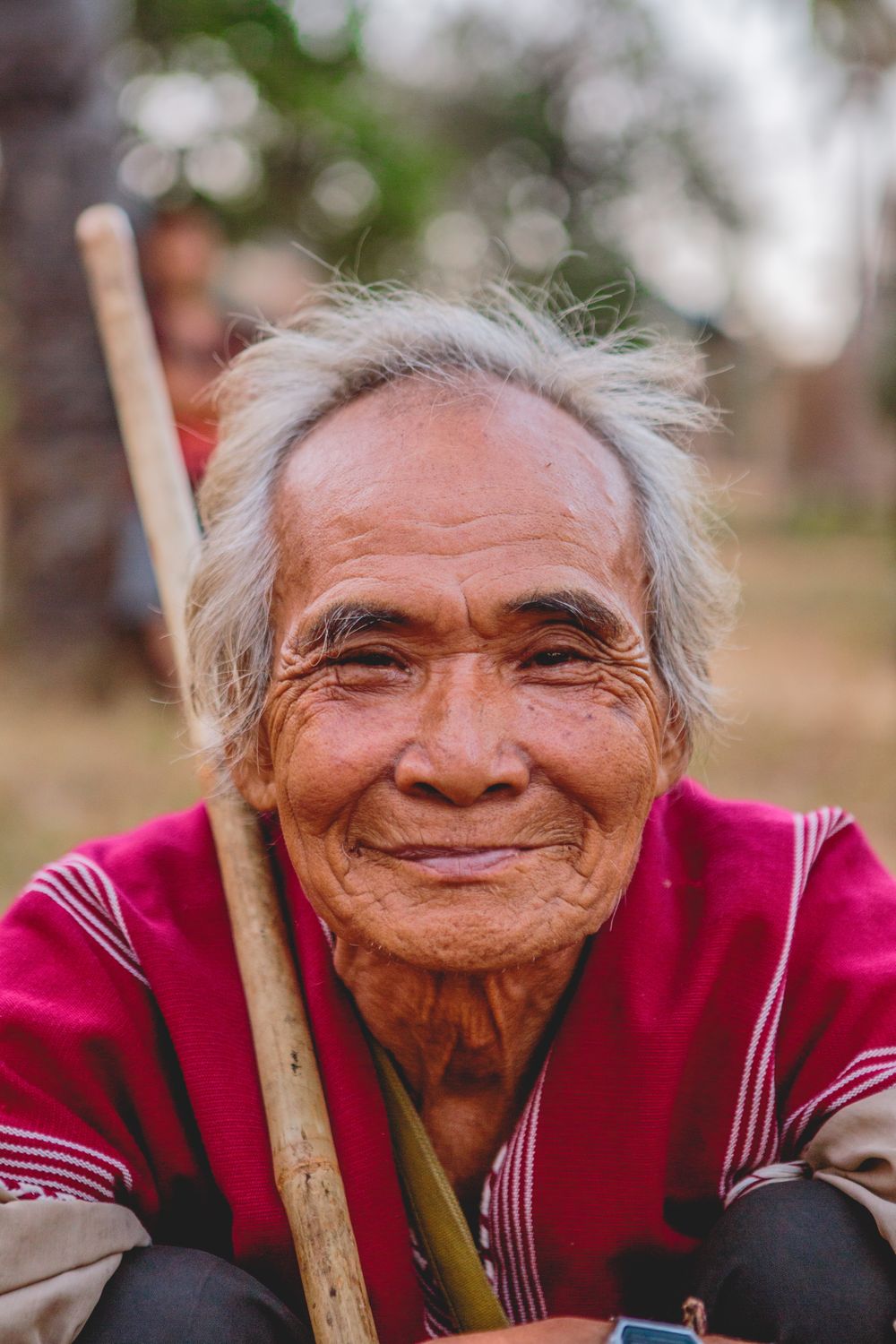 Bad Breath From Dentures, Bridges and Implants: Why Cleaning Isn't Enough 1 Older man smiling confidently outdoors after resolving bad breath from dentures