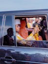 Traditional Ceremony Inside a Car Window
