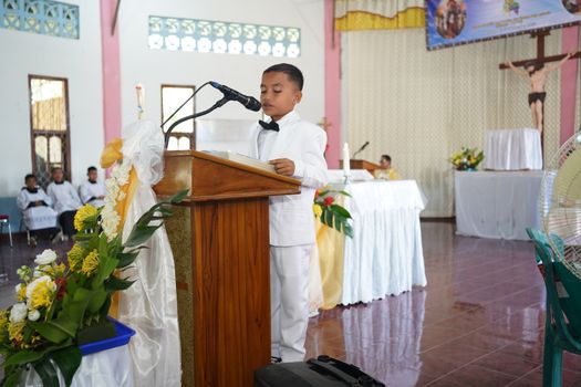 A young boy delivers a speech at a church ceremony in East Nusa Tenggara, Indonesia.