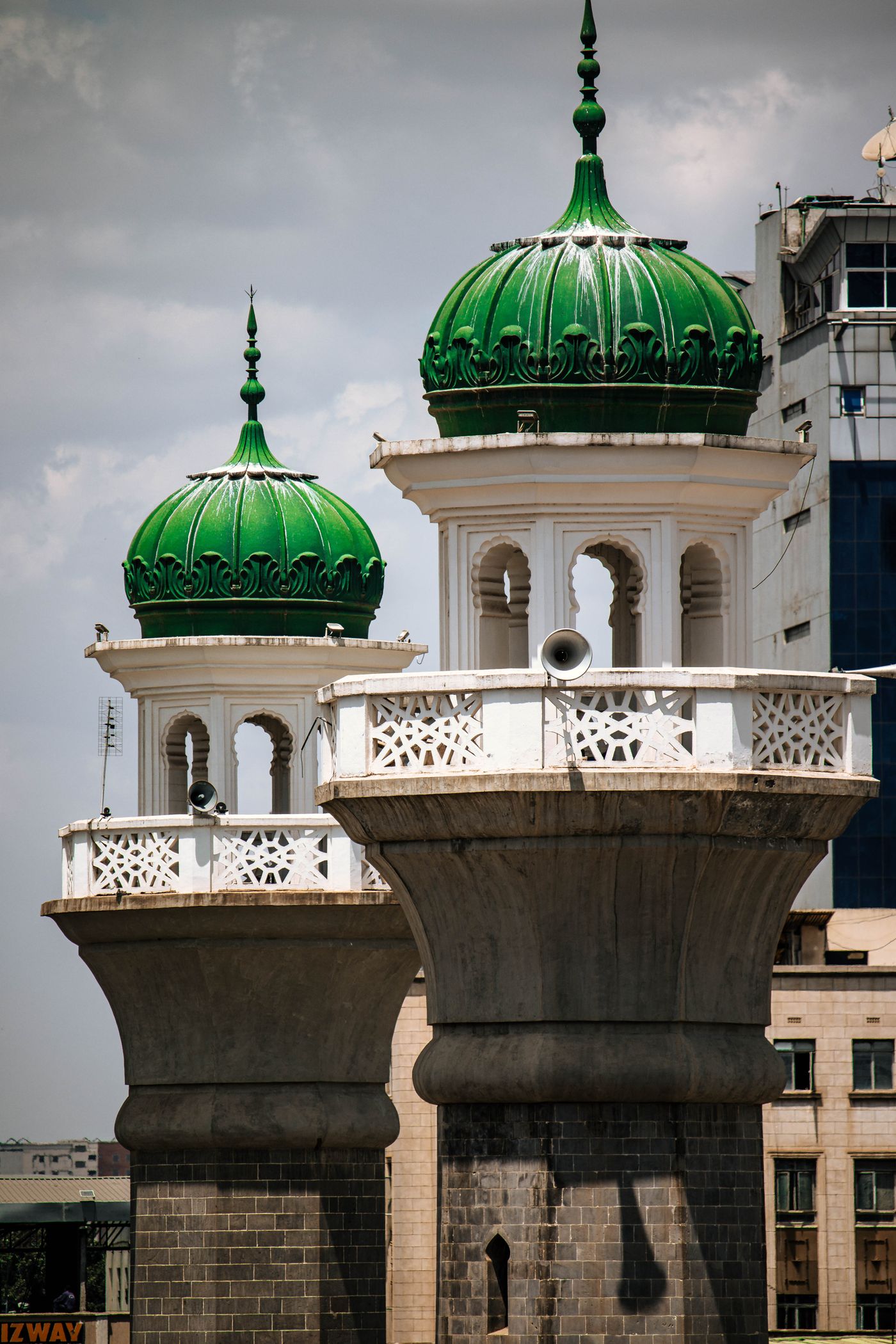 Green and silver domed minarets of a mosque in Nairobi