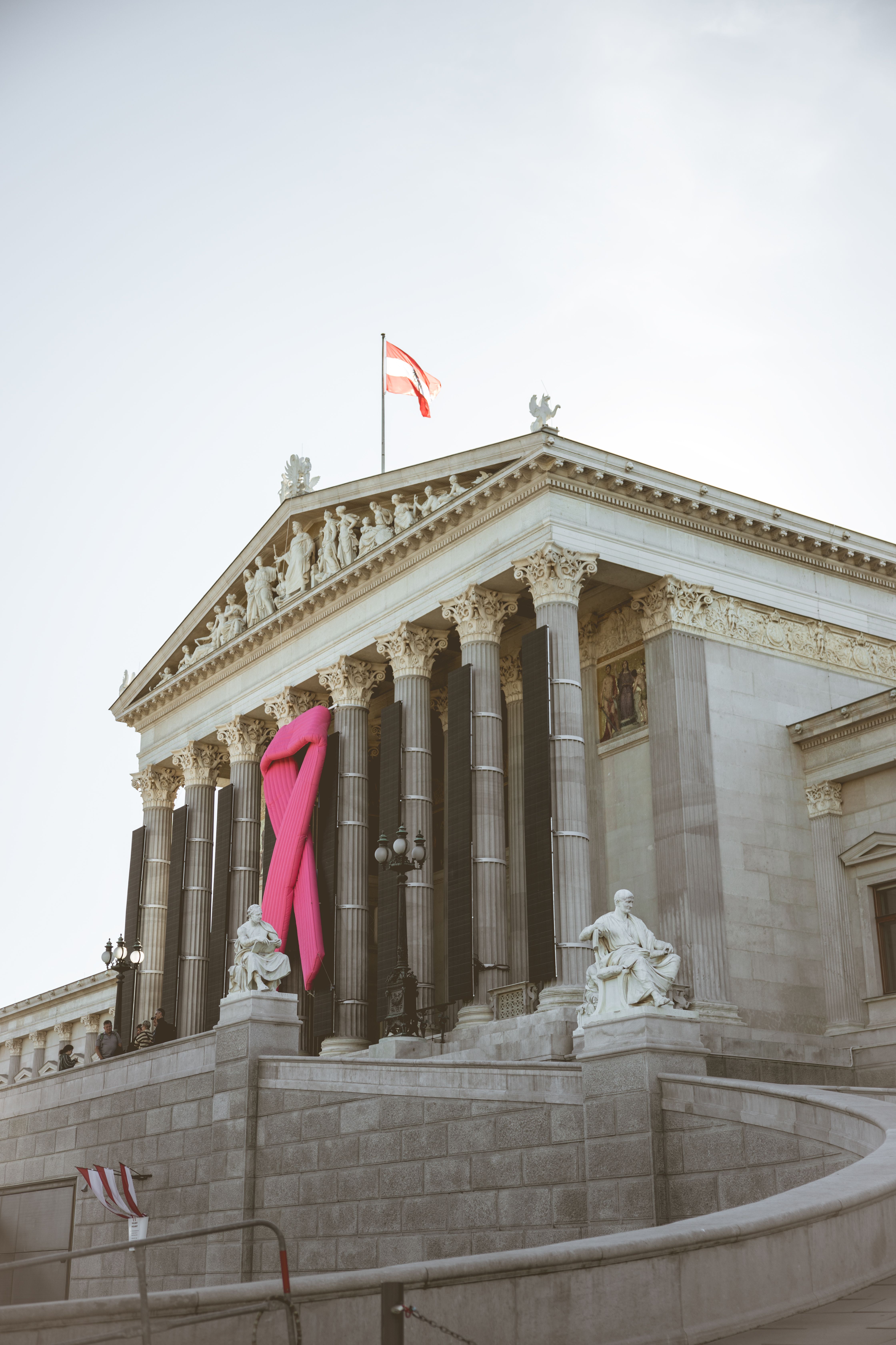 Vienna Parliament Building with Pink Ribbon · Free Stock Photo