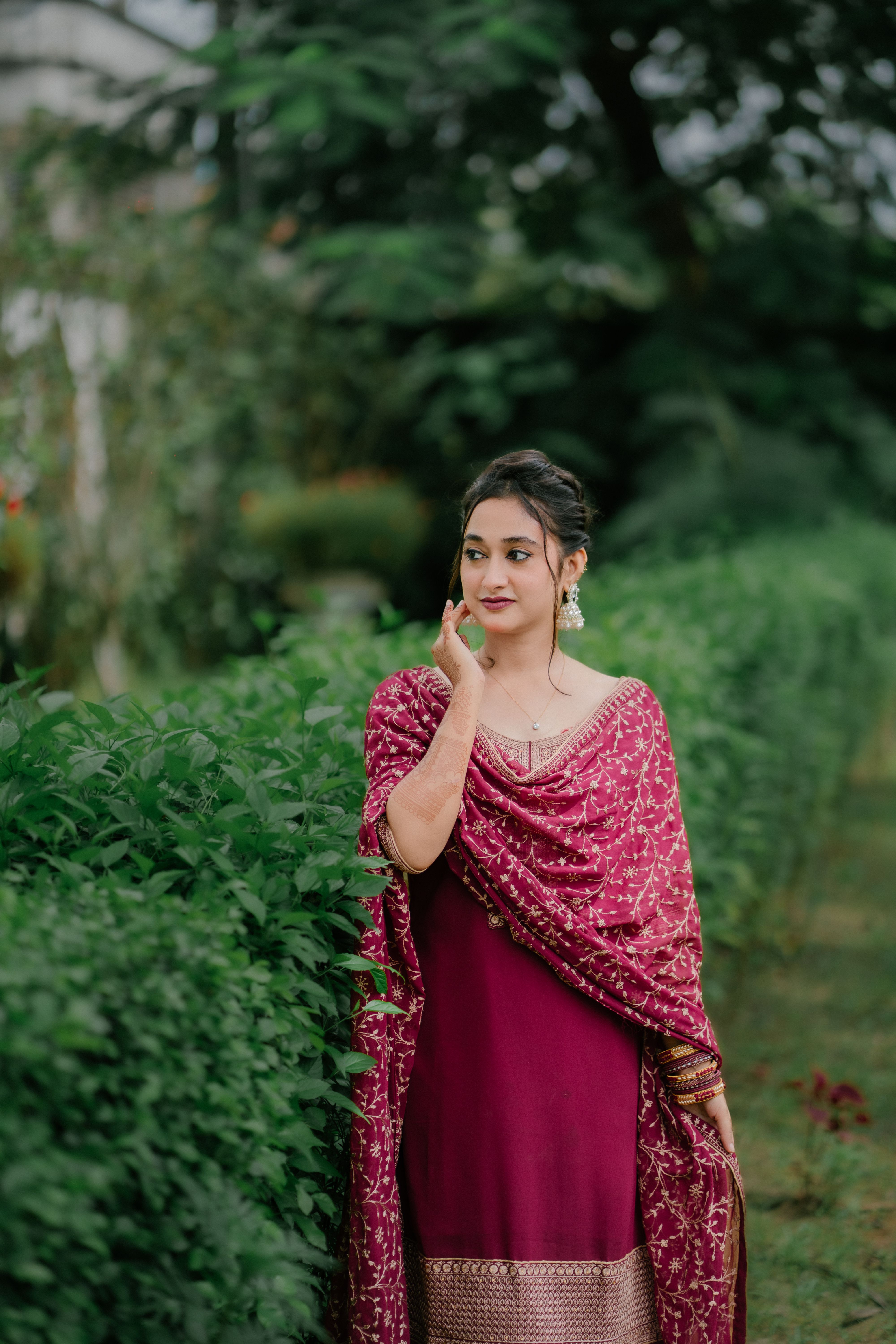 Woman in Traditional Dress Posing in Garden  Free Stock Photo