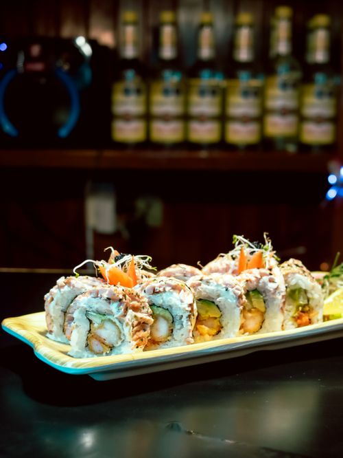 Free A vibrant plate of sushi rolls with fresh ingredients, perfect for a gourmet meal. Stock Photo