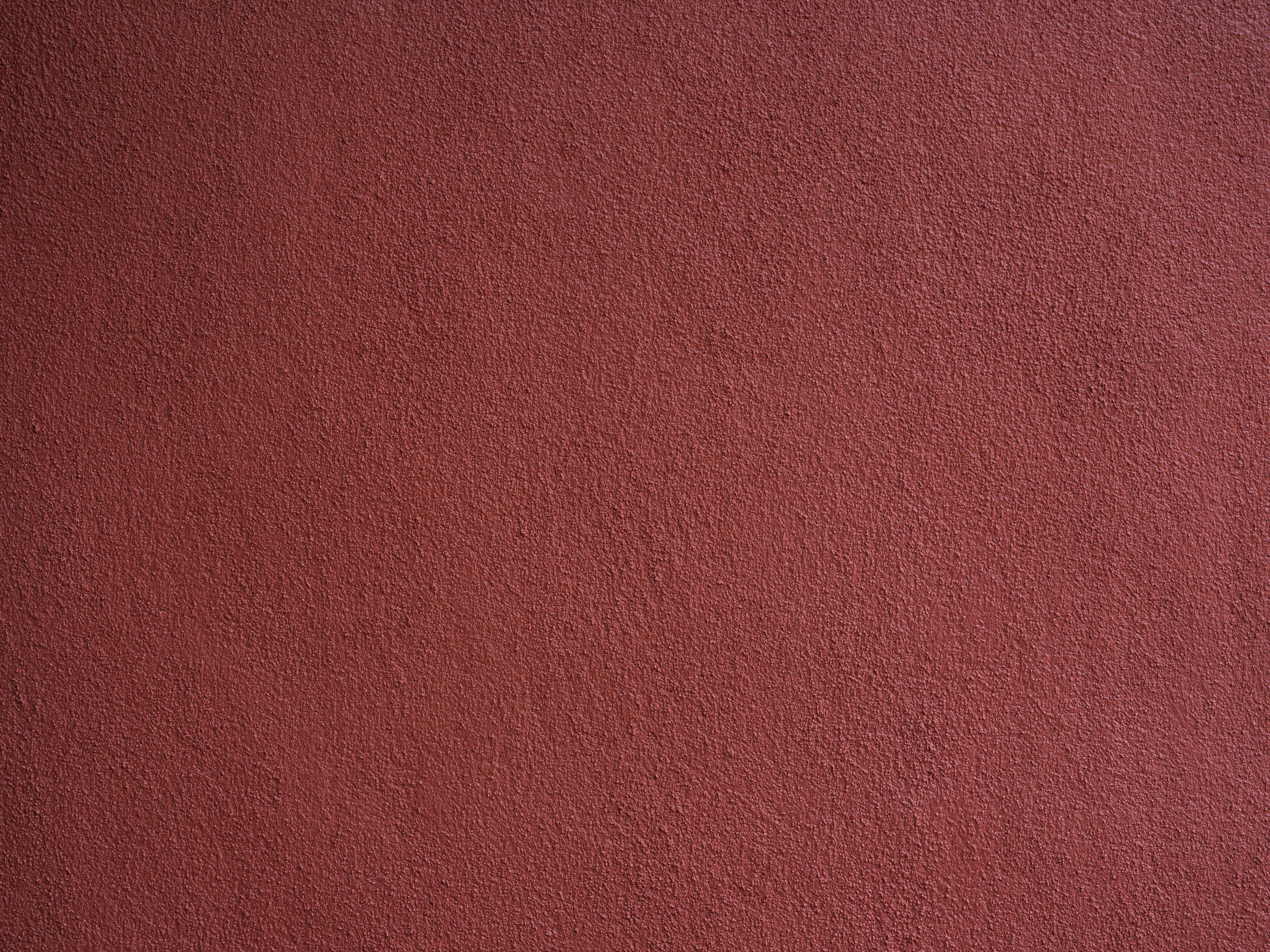 Kostenlos Detaillierte Nahaufnahme einer rot strukturierten Wand, perfekt für Hintergründe oder Designzwecke. Stock-Foto