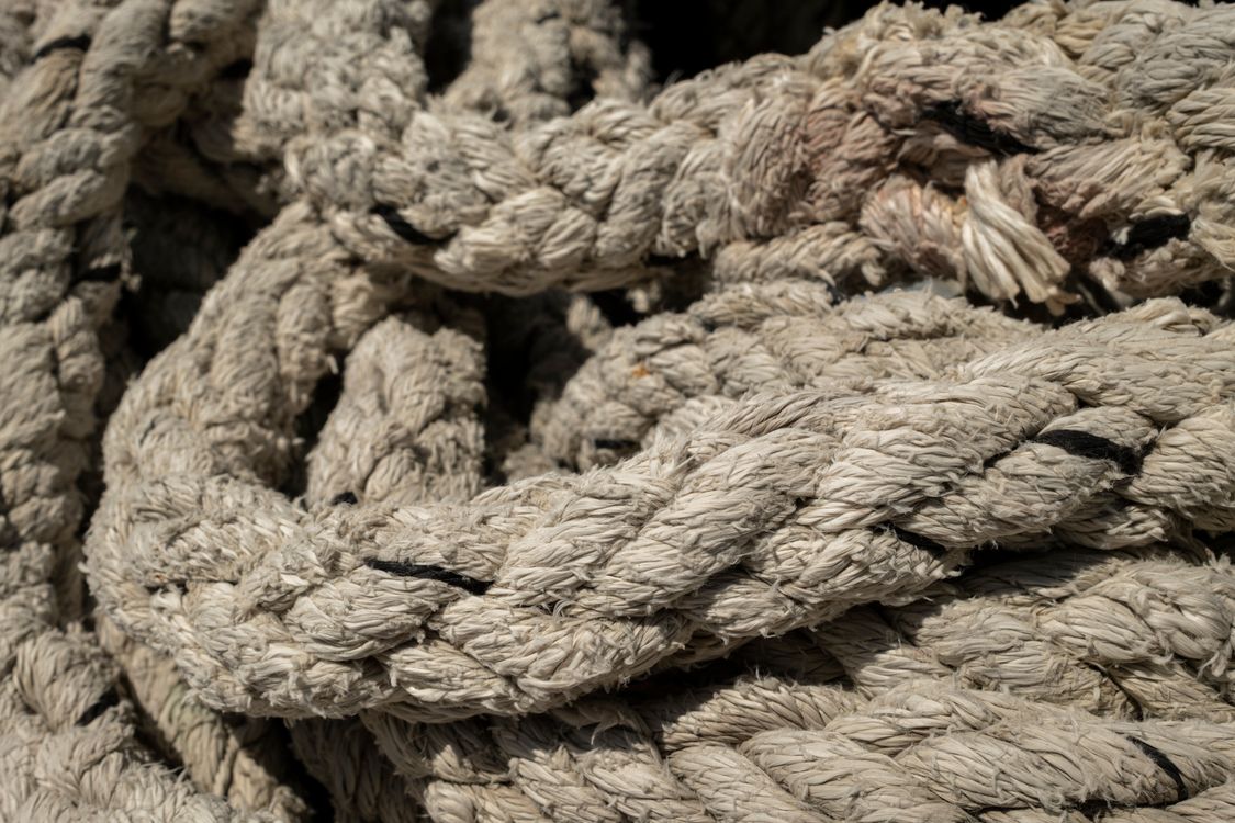 Weathered And Rugged Rope Close-Up of Weathered Nautical Rope Detail · Free Stock Photo