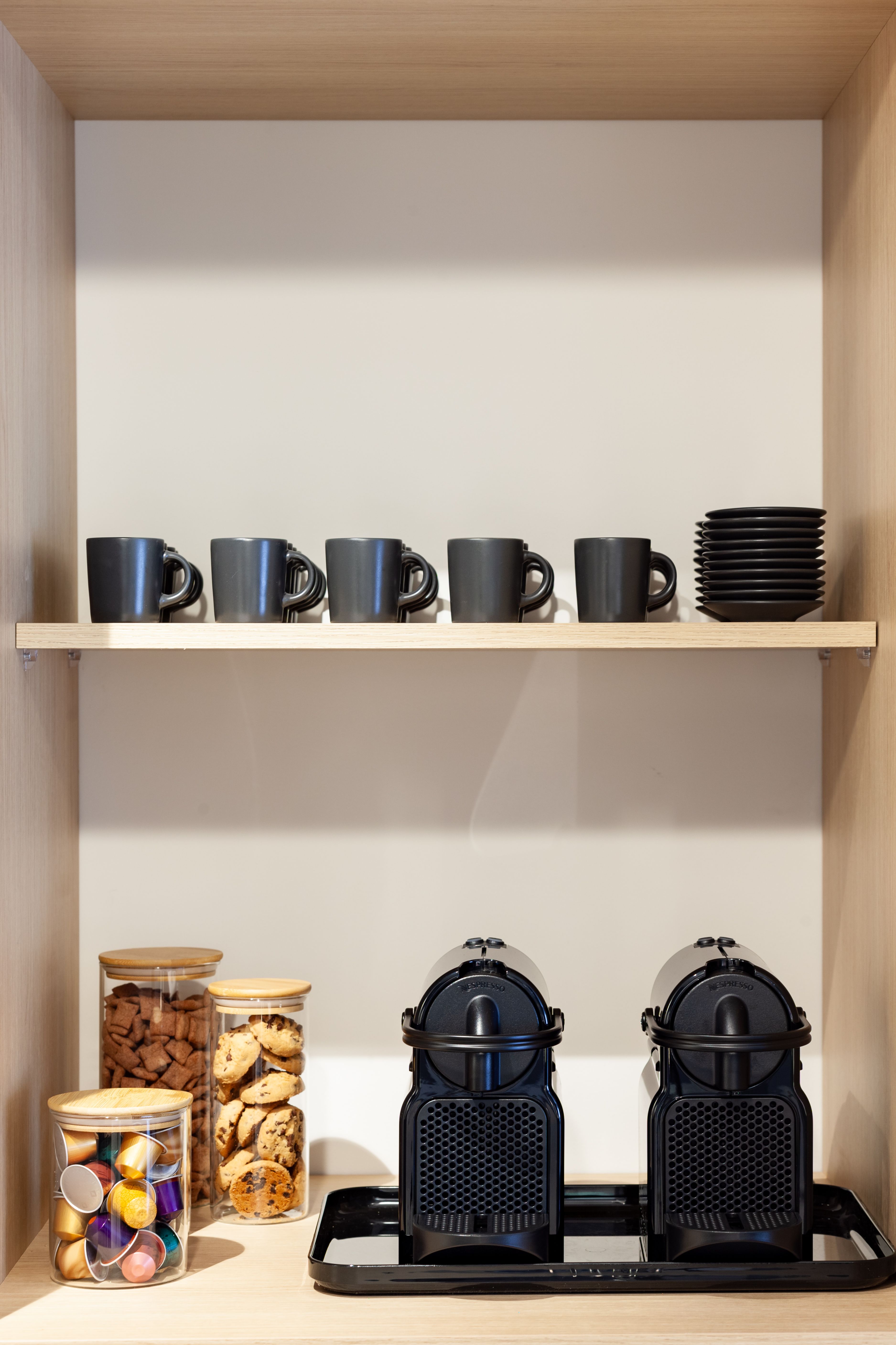 Divided plastic caddy holding coffee pods on a dollar tree coffee bar design