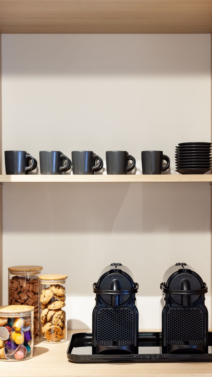 Divided plastic caddy holding coffee pods on a dollar tree coffee bar design