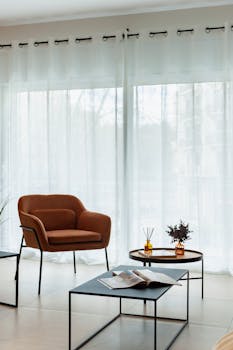Stylish living room featuring a brown armchair, coffee table, and decor in Barcelona.