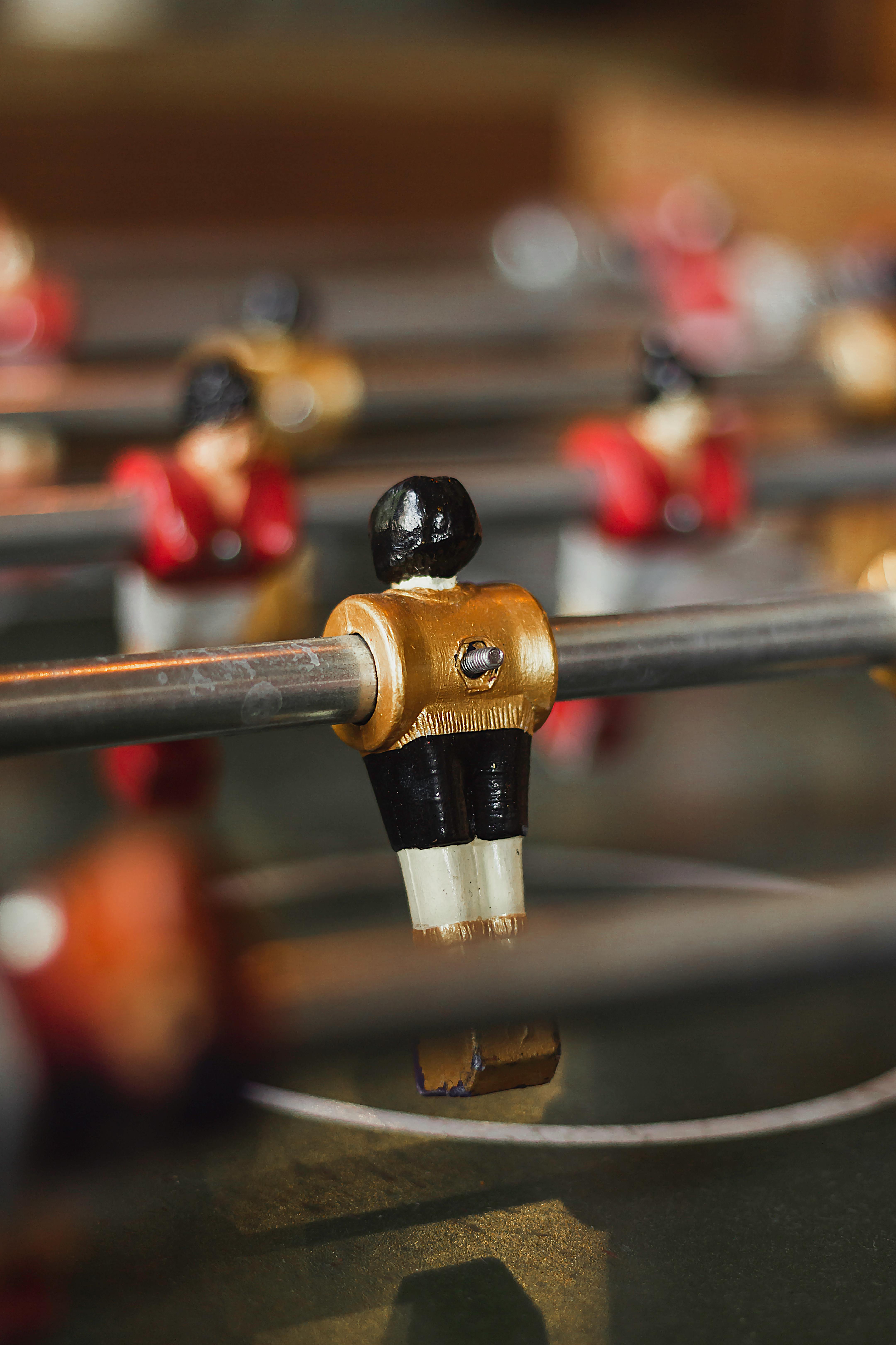 selective focus photography of foosball game