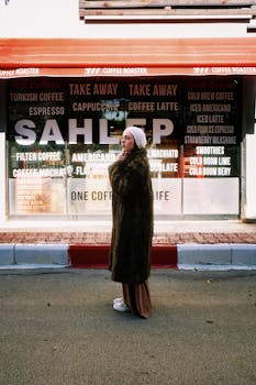 Woman in a fur coat in front of a trendy coffee shop in Antalya, Turkey.