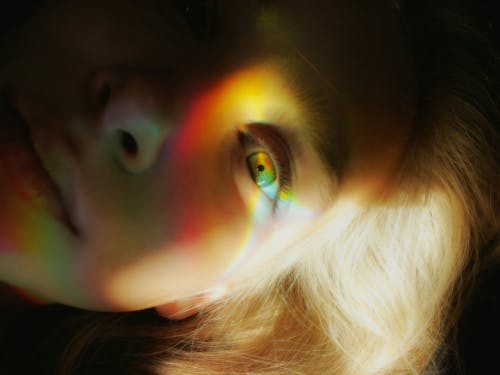 Free Woman's Face With Light Reflections
 Stock Photo