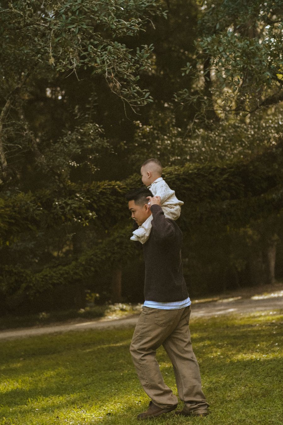 Family wellness moments in Bengaluru – father carrying child in a sunlit park