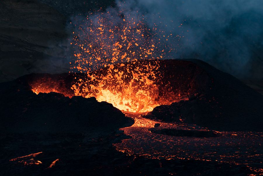 Lava erupting from a fissure at night — photo by Gylfi Gylfason on Pexels