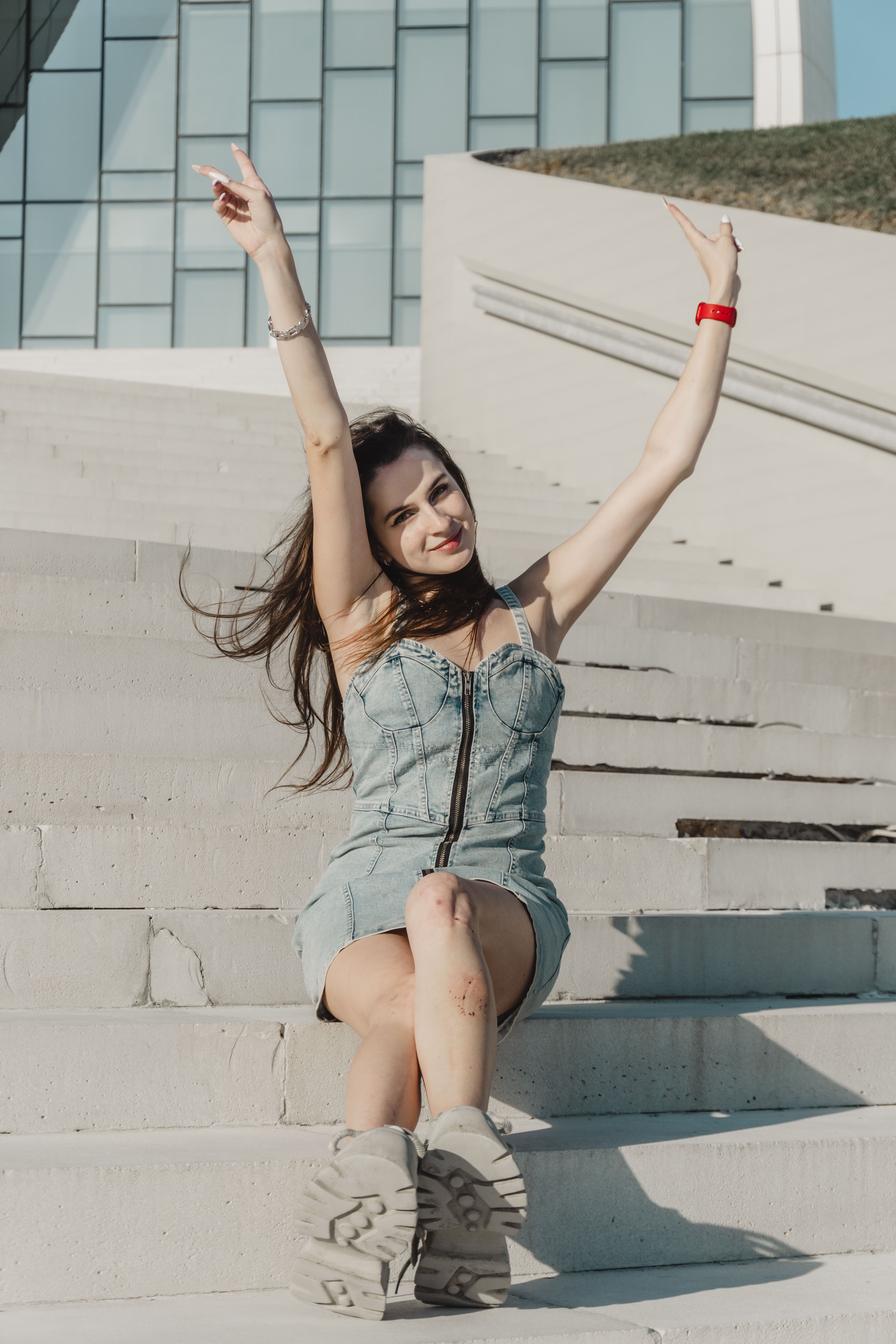 Happy Woman Posing on Urban Stairs Outdoors · Free Stock Photo