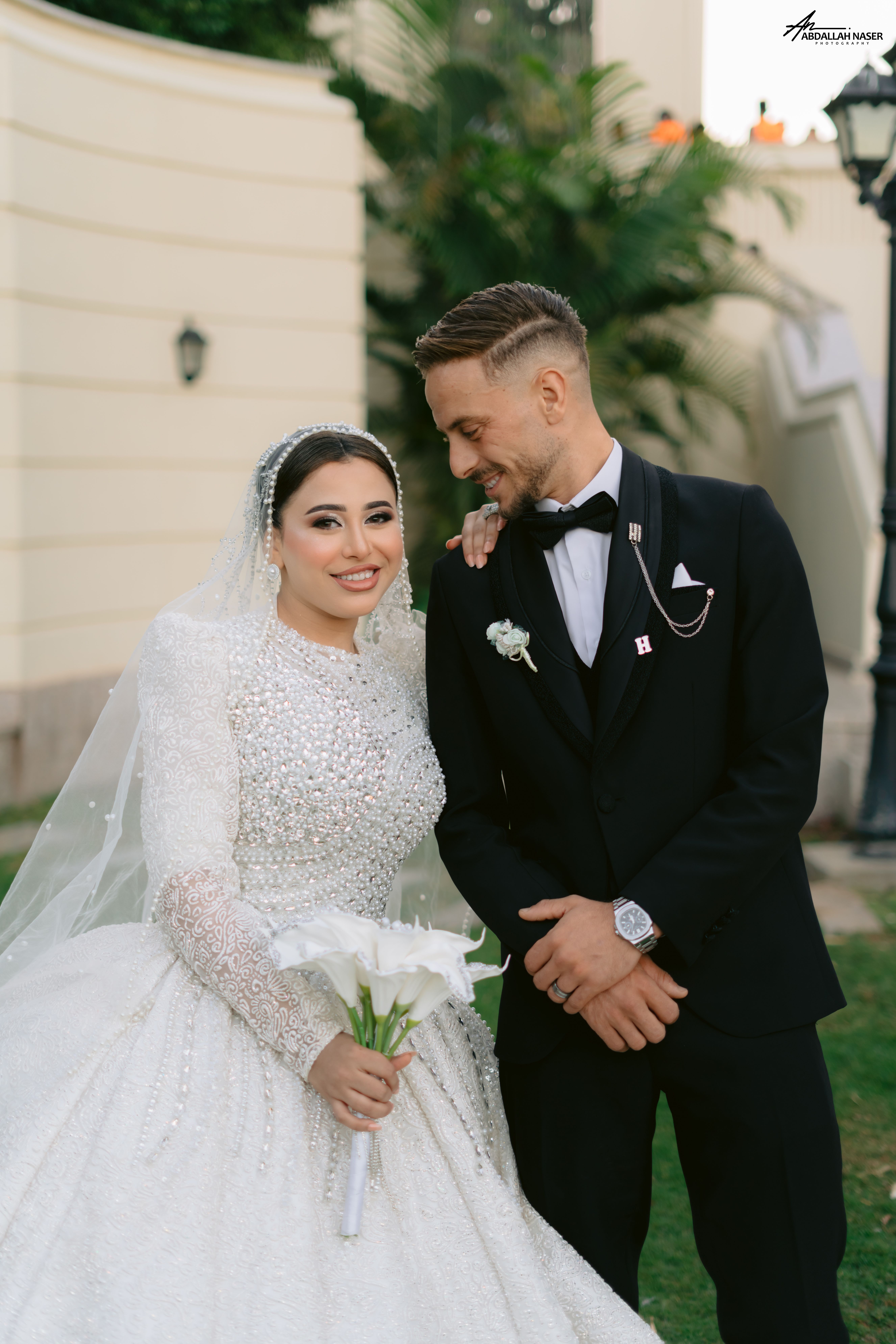 Charming wedding photo capturing joyful bride and groom outdoors.