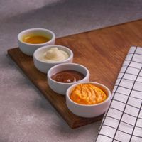 Condiment in a small ceramic bowl — photo by Bia Metidieri on Pexels