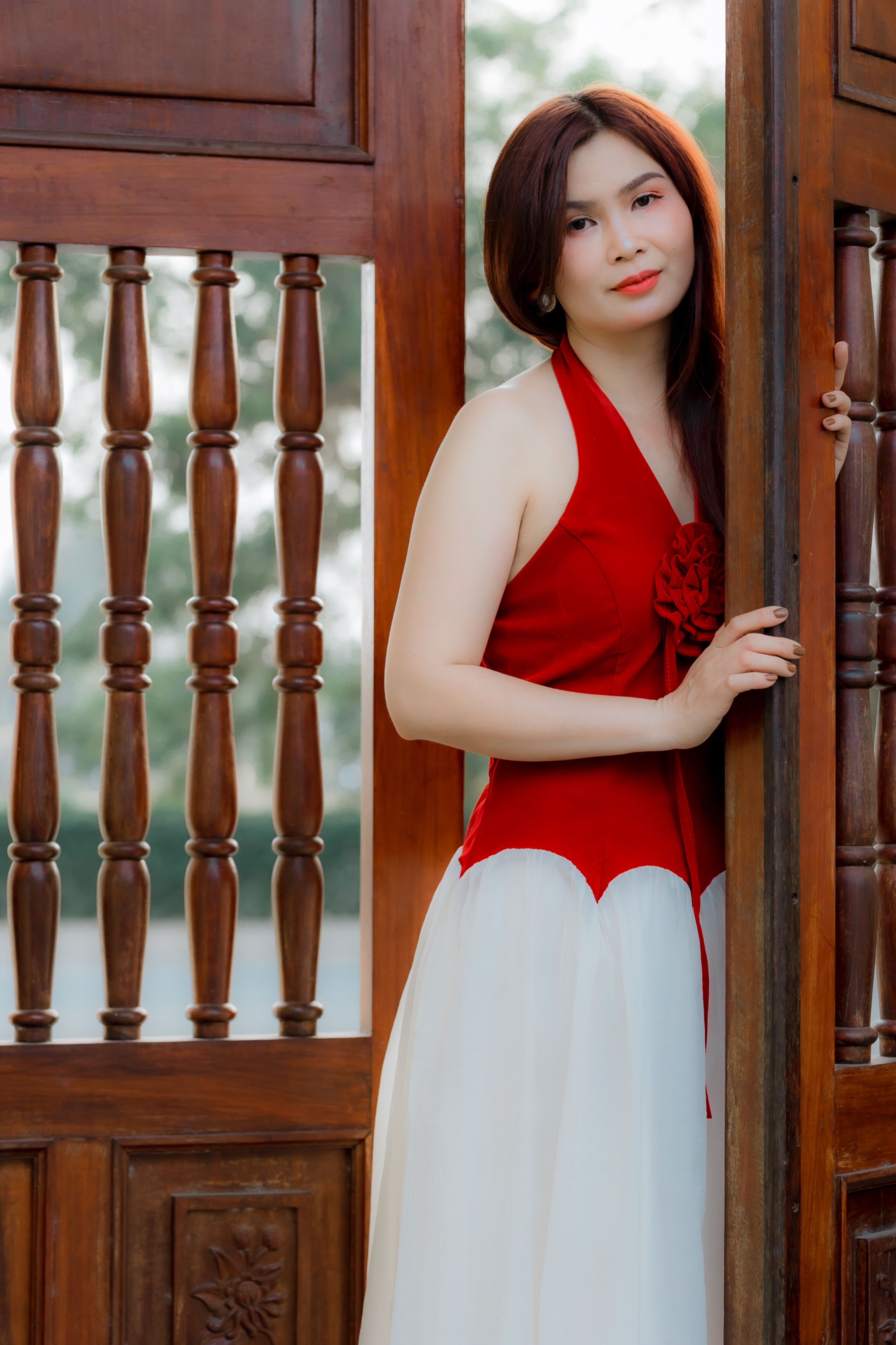 Young Woman in Red Dress by Wooden Doorway Free Stock Photo Young Woman in Red Dress by Wooden Doorway Free Stock Photo
