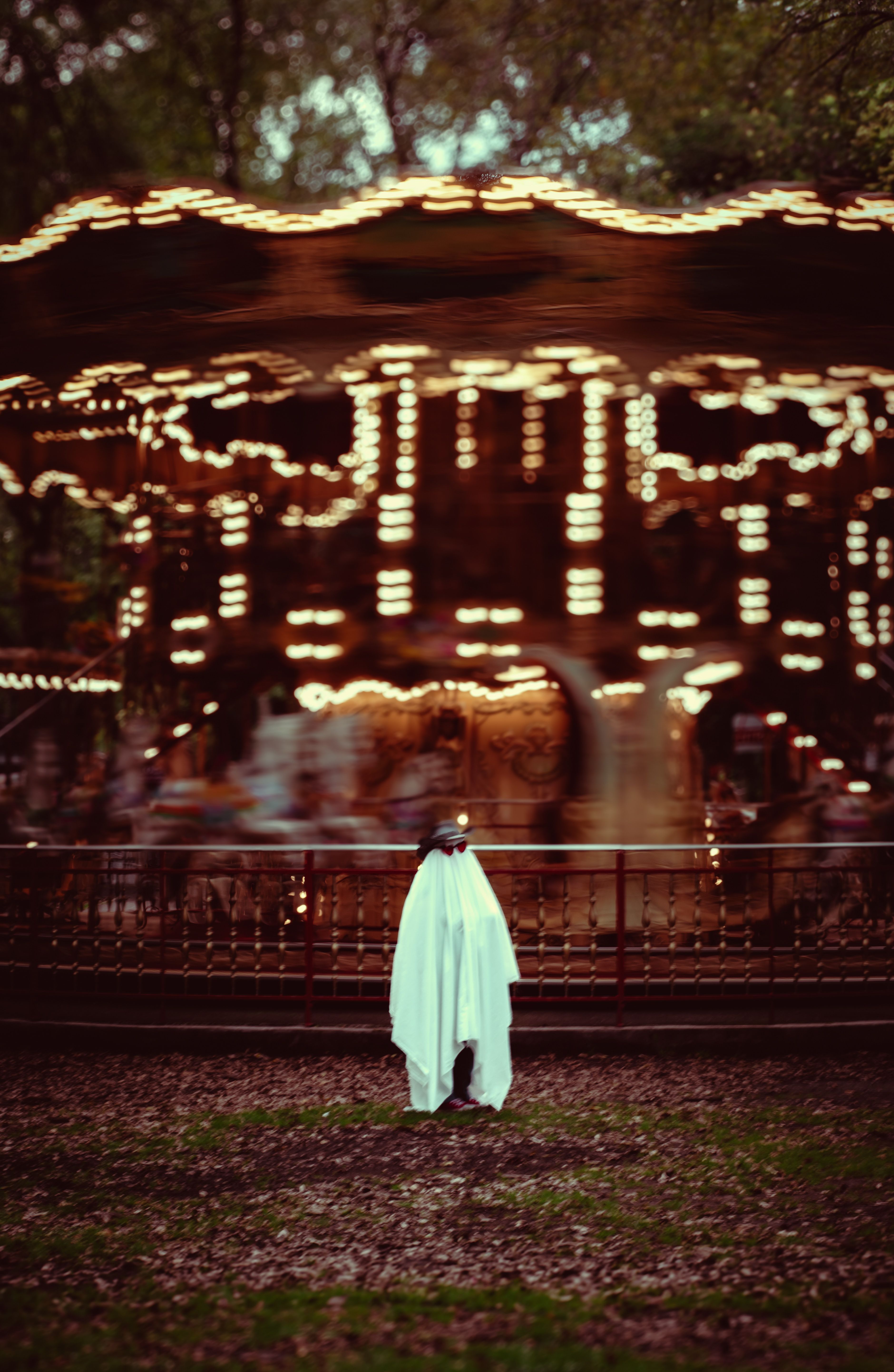 Ghostly Figure at Spinning Carousel in Mexico City · Free Stock Photo