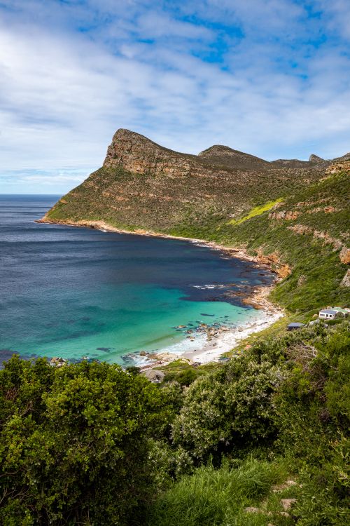 Free Stunning view of Cape Point with crystal clear turquoise waters and rugged cliffs. Stock Photo