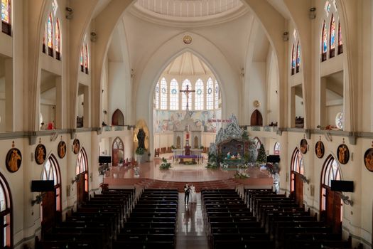 A majestic cathedral interior featuring a wedding couple and stunning architectural details.