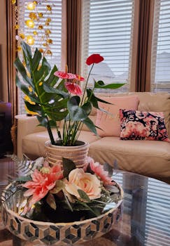 Sophisticated living room featuring vibrant flowers and elegant decor.