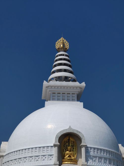 Free Majestic white stupa with intricate designs under a clear blue sky. Perfect for travel imagery. Stock Photo