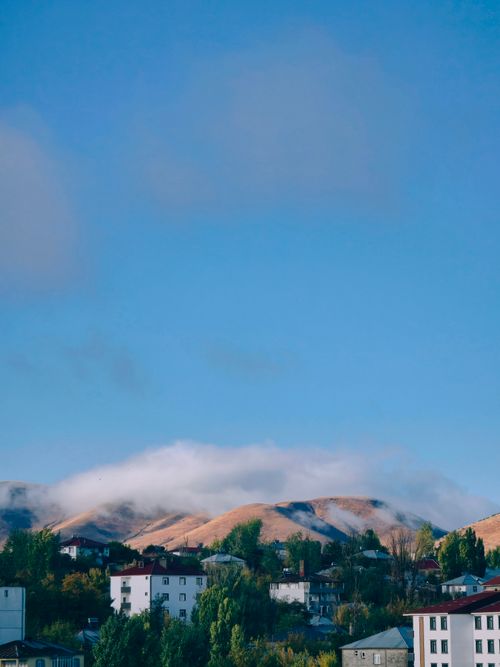 Free Charming view of Bulanık's hills and residential area under a clear blue sky. Stock Photo