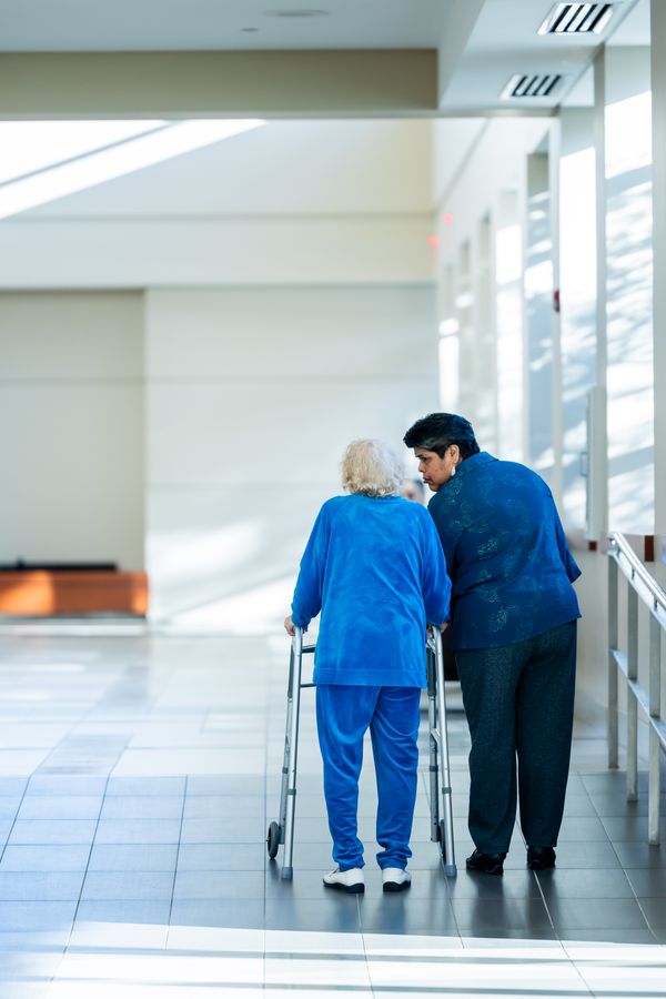 Nurse assisting patient with mobility