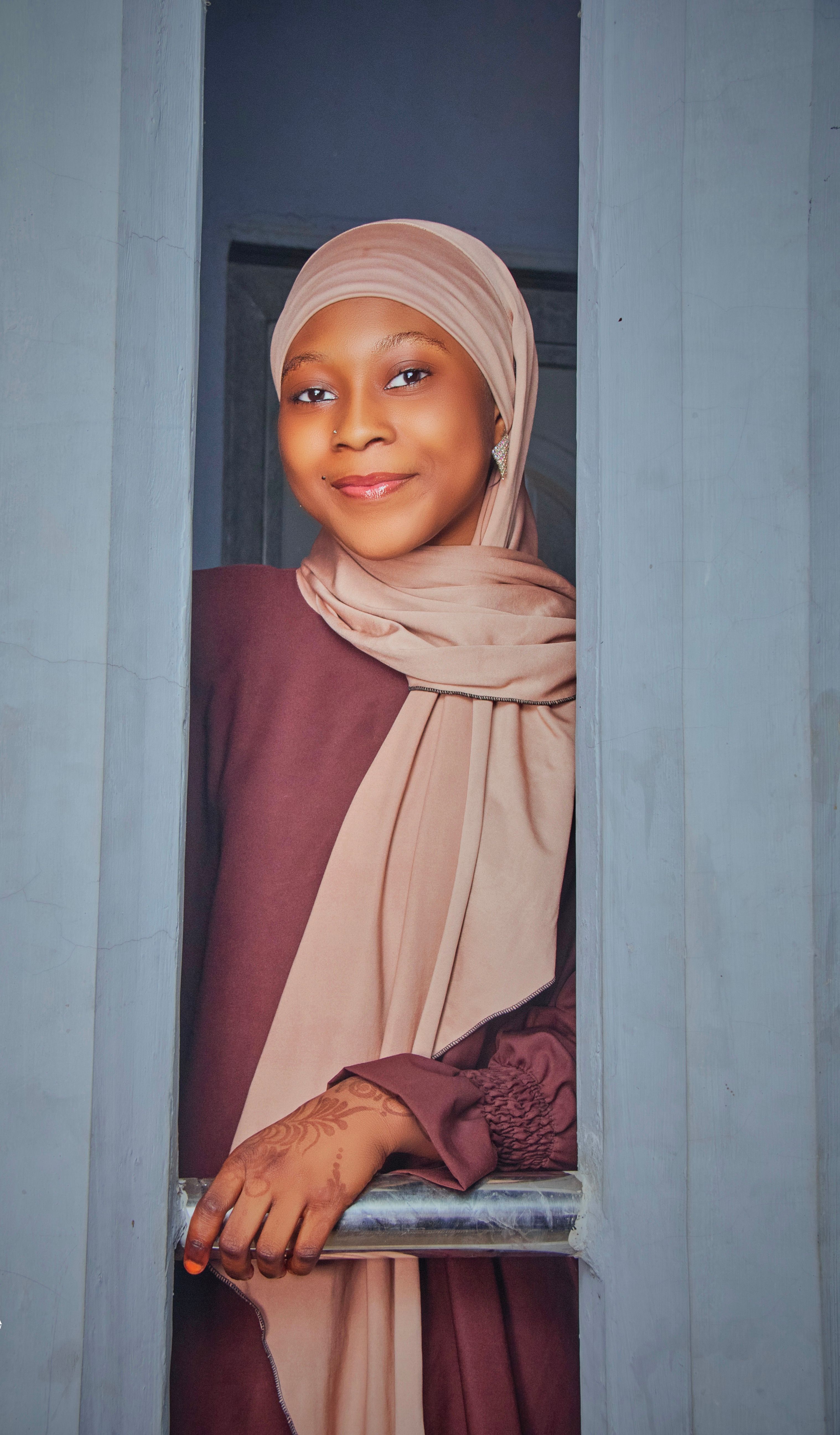 Young Woman in Traditional Modest Attire Smiling · Free Stock Photo