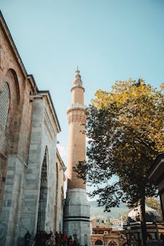 A captivating view of the Great Mosque's minaret against a clear sky, highlighting its architectural beauty.