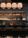 Chic Bar Interior with Illuminated Shelves in Thailand