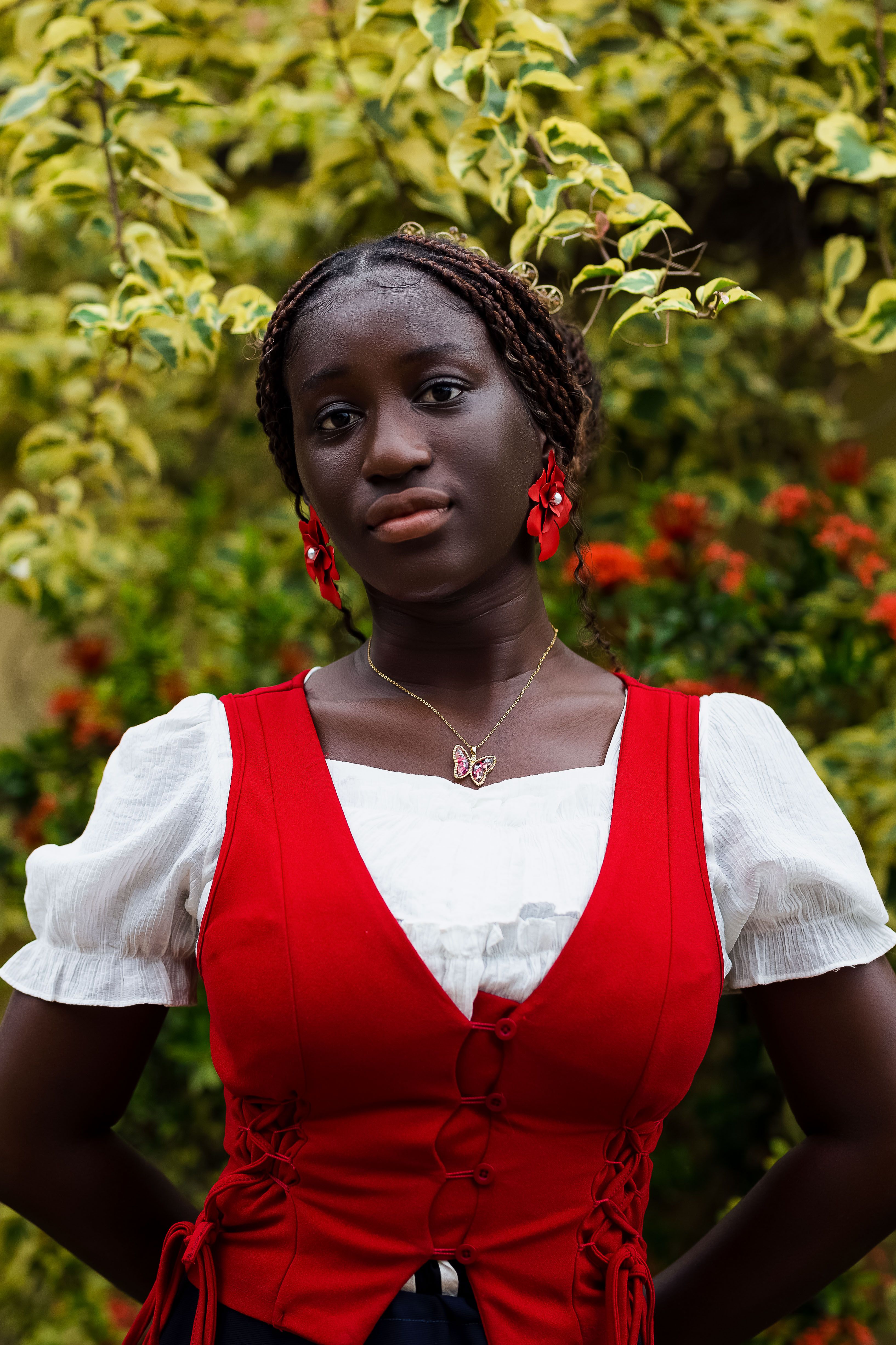 Elegant Portrait of a Woman in Red Dress Outdoors · Free Stock Photo