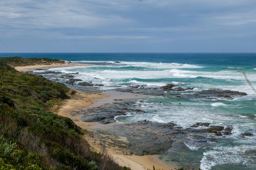 Free Dramatic coastal landscape showcasing waves crashing against rocky shorelines on the Great Ocean Walk in Victoria, Australia. Stock Photo