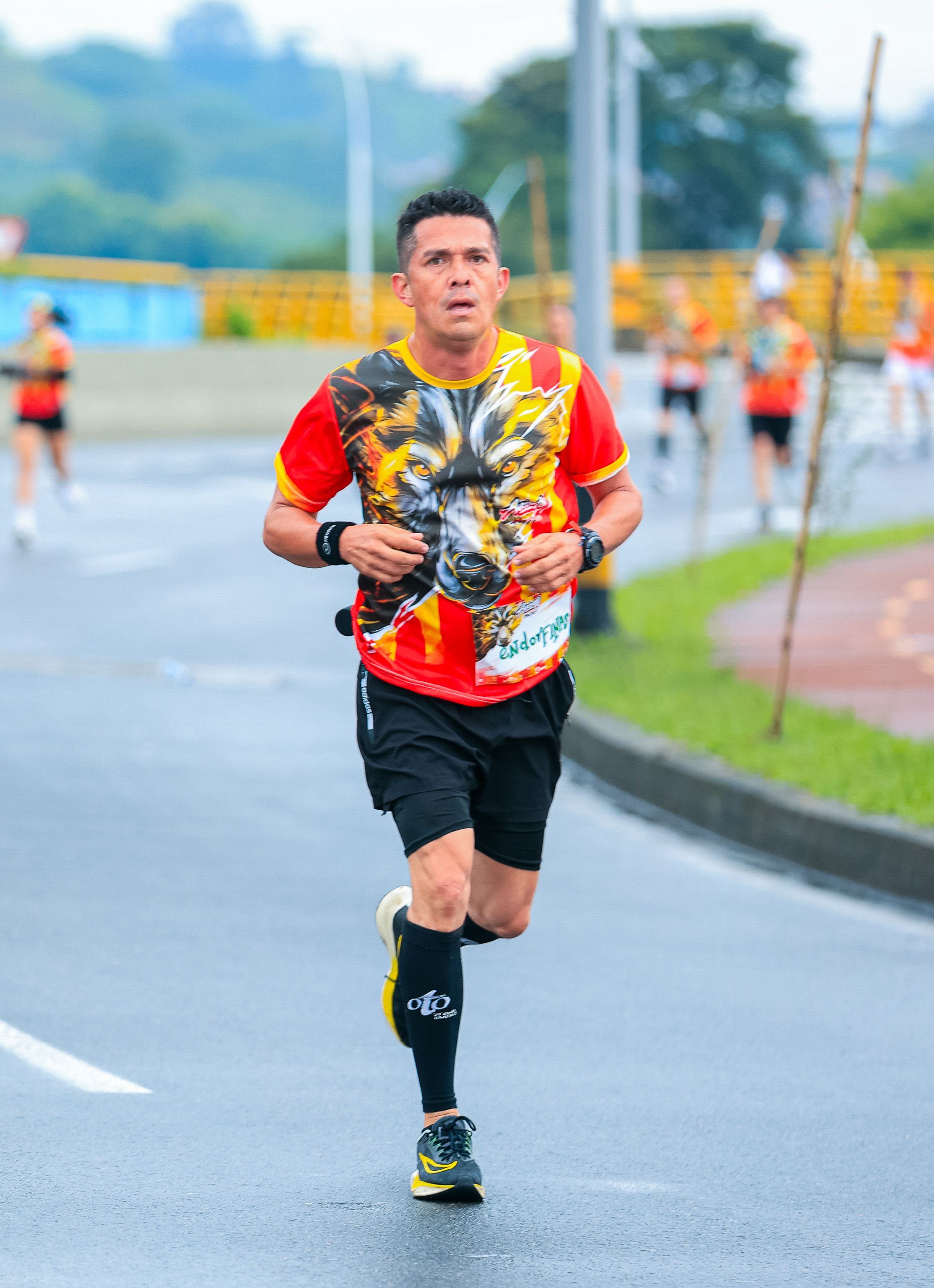 Focused Male Runner in Vibrant Urban Marathon