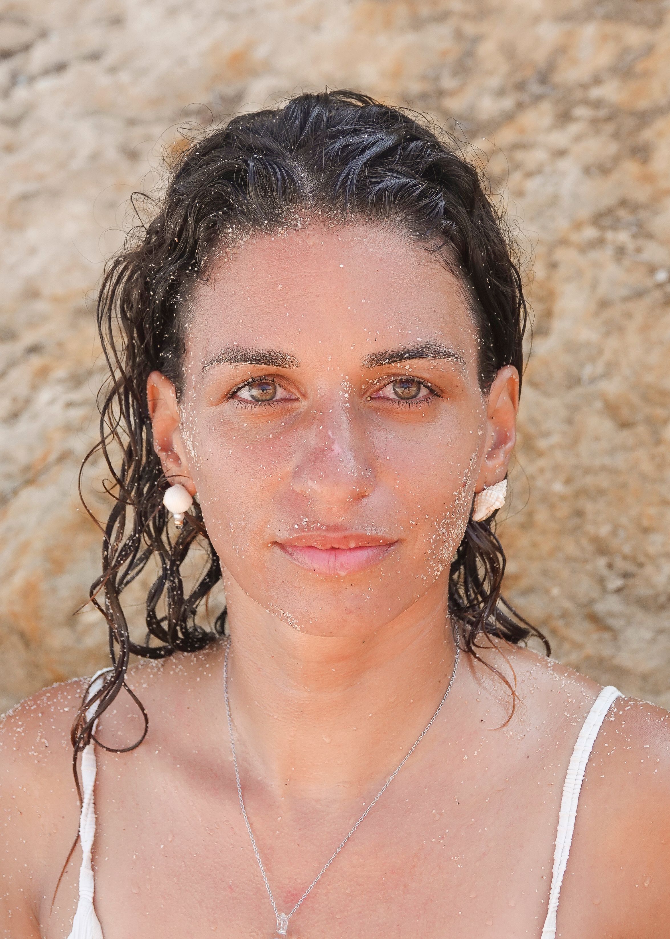 Portrait of Woman with Sandy Skin by the Beach · Free Stock Photo
