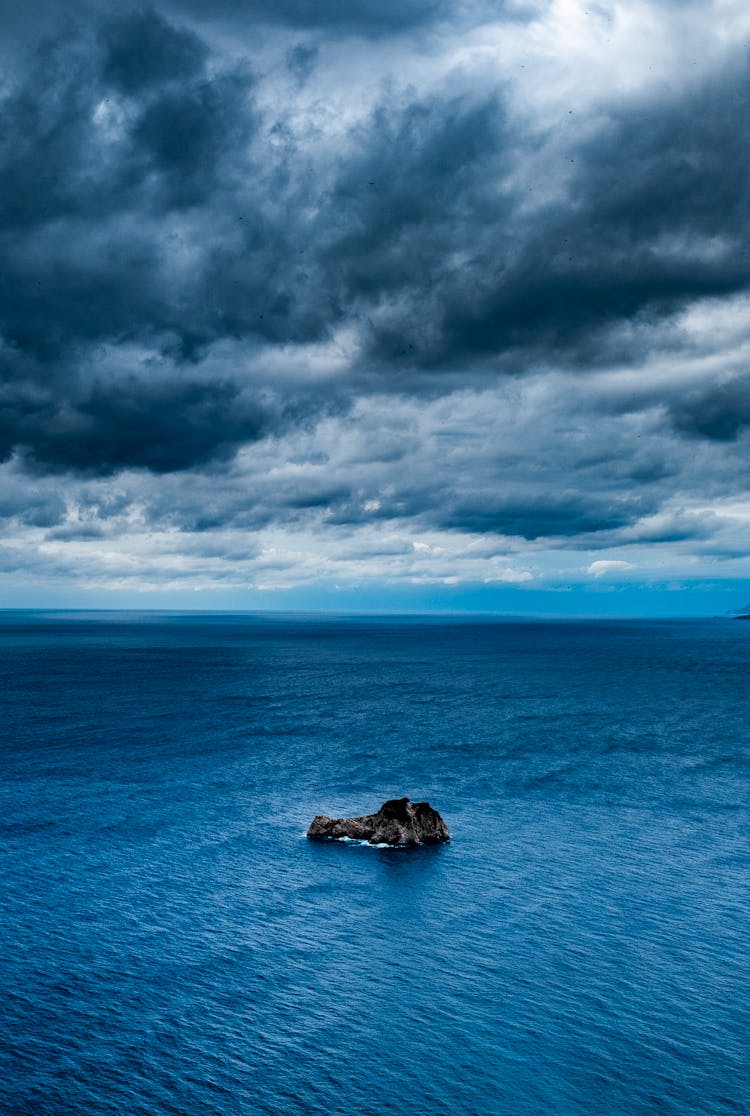 Small Island On Rocky Sea