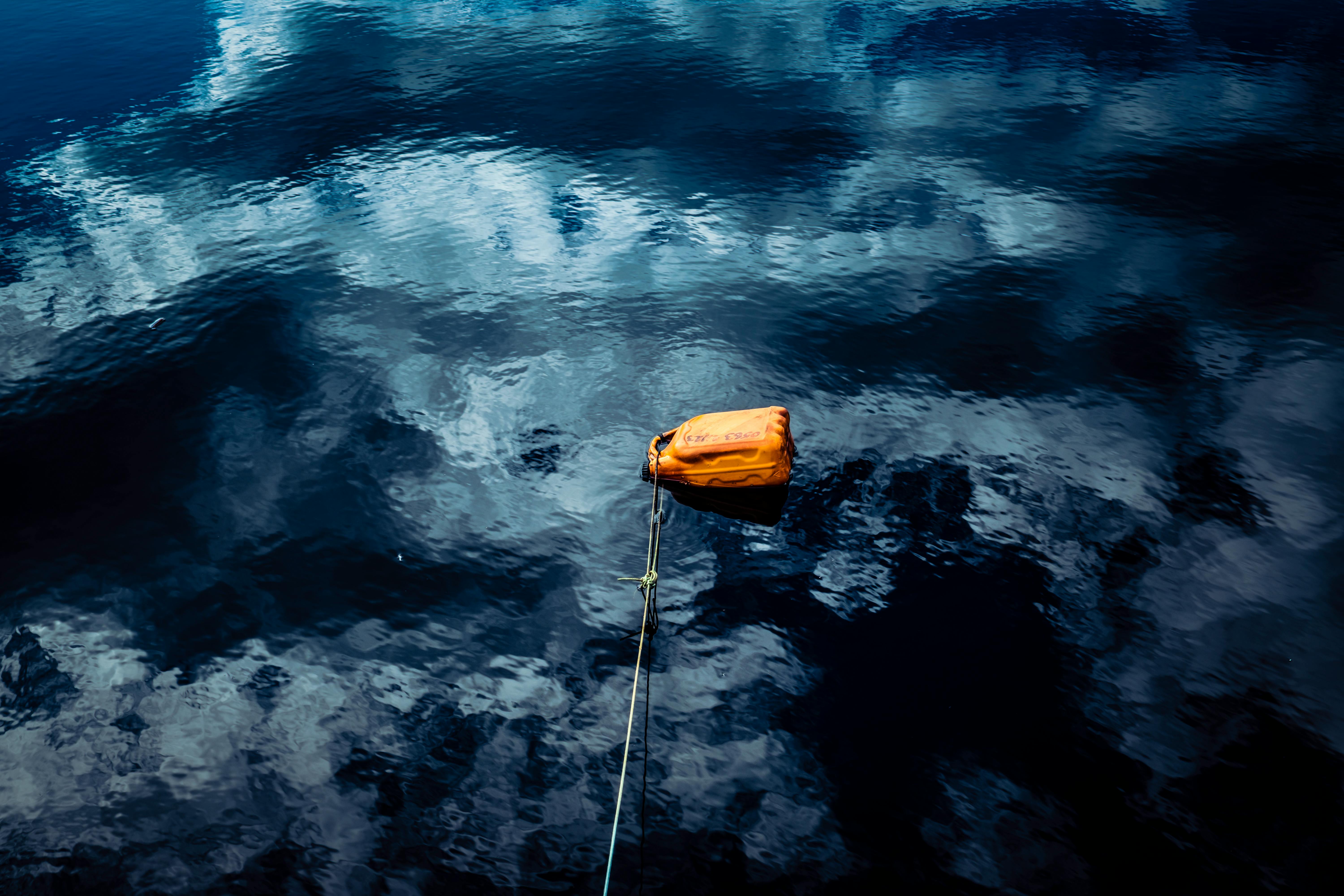 Brown Container Floating on Water · Free Stock Photo