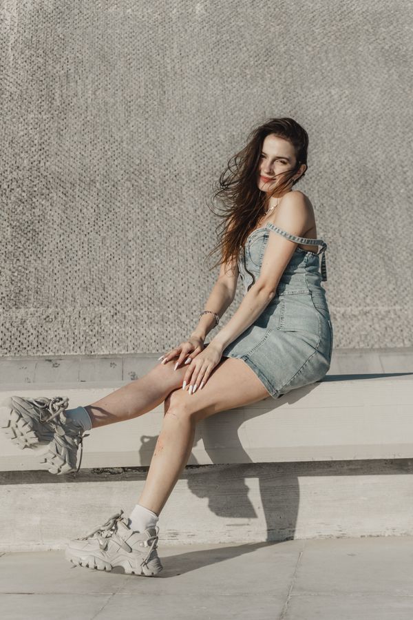 woman wearing platform sneakers and mini dress