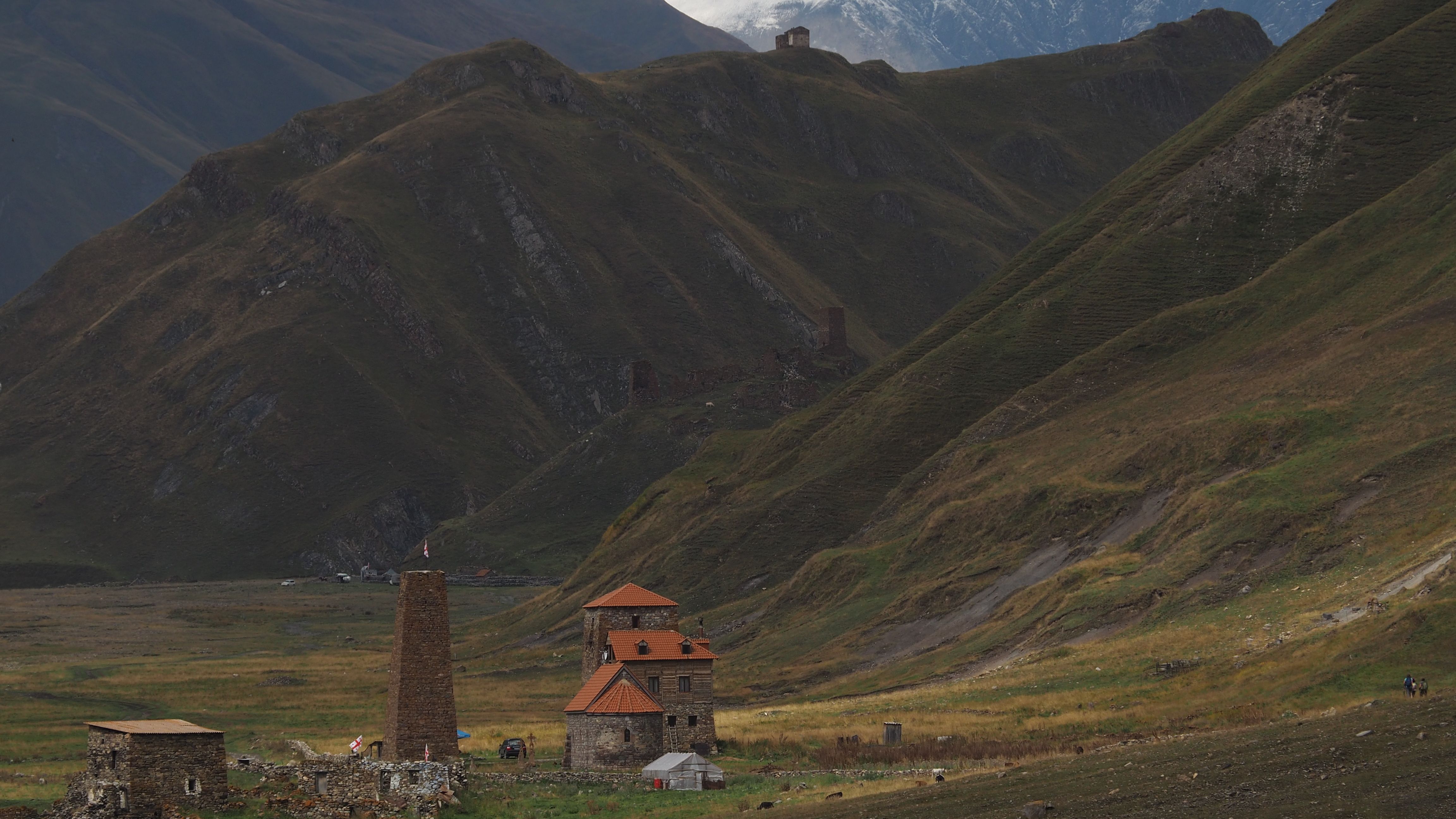 Explore the serene landscape of Mtscheta-Mtianeti with its ancient Svan tower and lush hills.