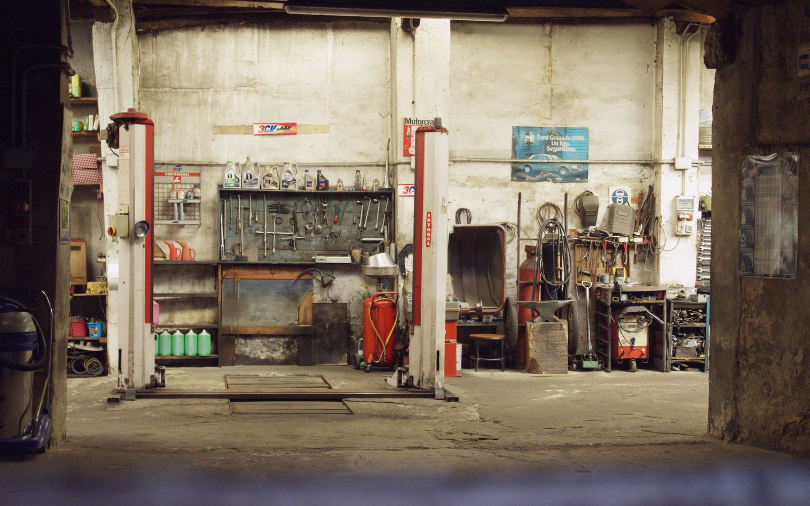 A quiet workshop with tools and machinery along the walls